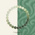 Bracelet: round Hetian jade beads shading from dark green to pale celadon green