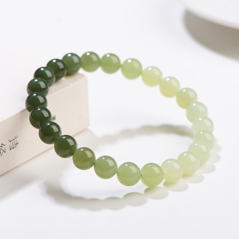 Bracelet: round 6mm Hetian jade beads shading from dark green to pale celadon, third view