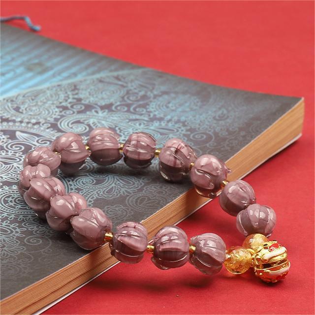 Bracelet: dusky lavender lotus-shaped liuli glass beads with a Tunjin beast charm, second view