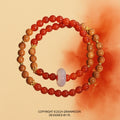 Bracelet: two strands of red agate beads and brown wood beads with a frosted white ring