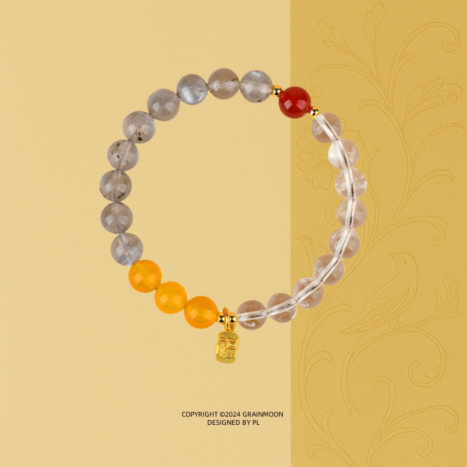 Bracelet: grey lab-created pearl, yellow citrine and clear quartz beads with one red bead and a small gold-coloured charm
