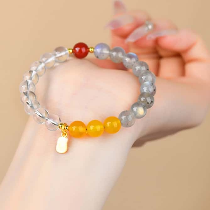 Bracelet: grey lab-created pearl, yellow citrine and clear quartz beads with one red bead, second view