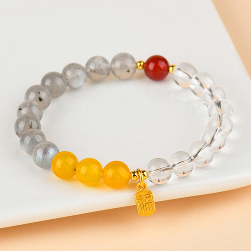Bracelet: grey lab-created pearl, yellow citrine and clear quartz beads with one red bead, third view