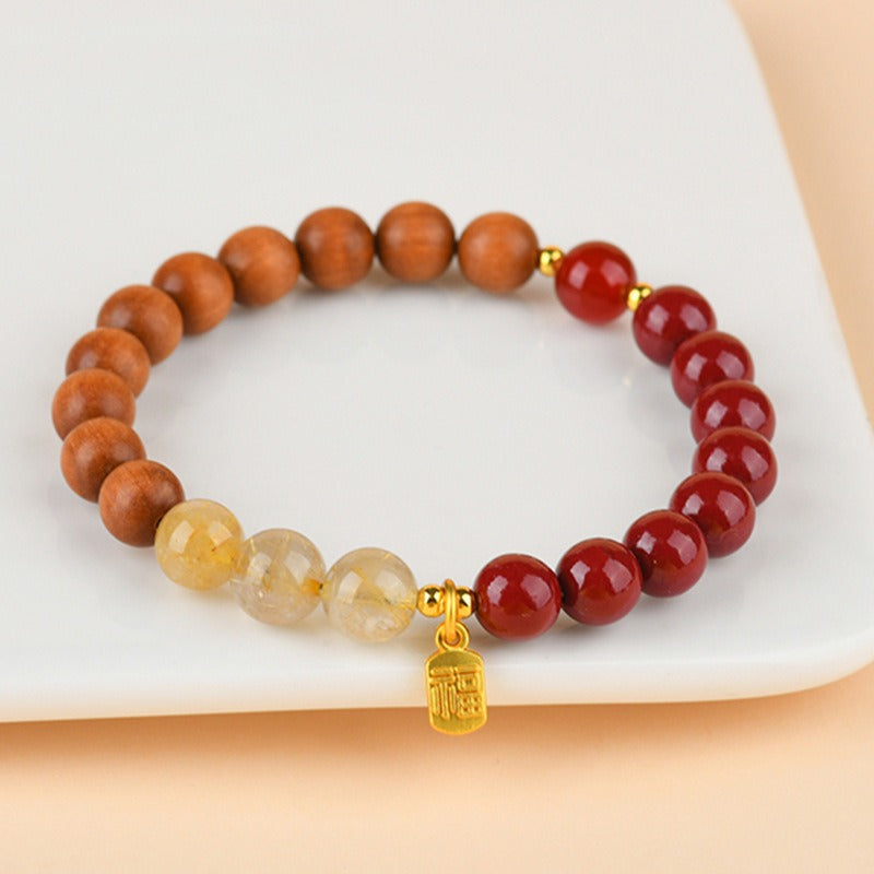 Bracelet: brown sandalwood, dark red agate and pale golden quartz beads, second view