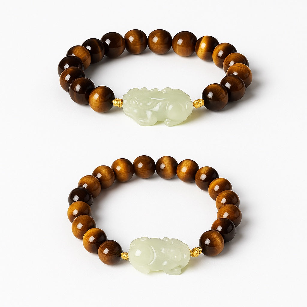 Bracelet: brown tiger's eye beads with a pale green Hetian jade Pixiu carving, second view