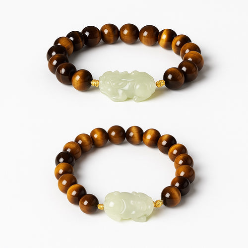Bracelet: brown tiger's eye beads with a pale green Hetian jade Pixiu carving, second view