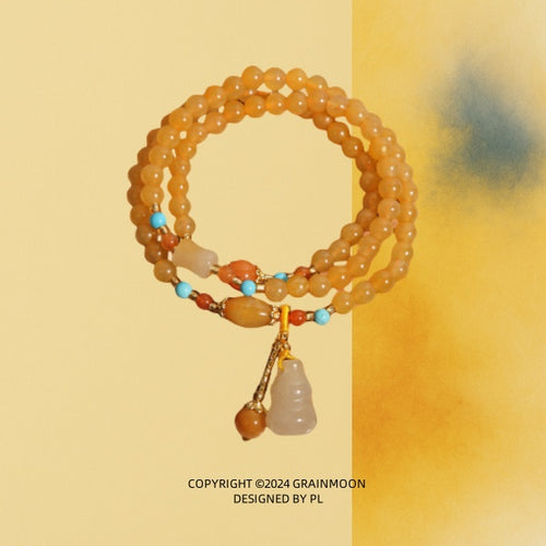 Bracelet: multi-wrap golden-yellow lab-created jade beads with turquoise-blue accents and a carved gourd charm
