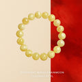 Bracelet: round pale yellow marbled amber beads