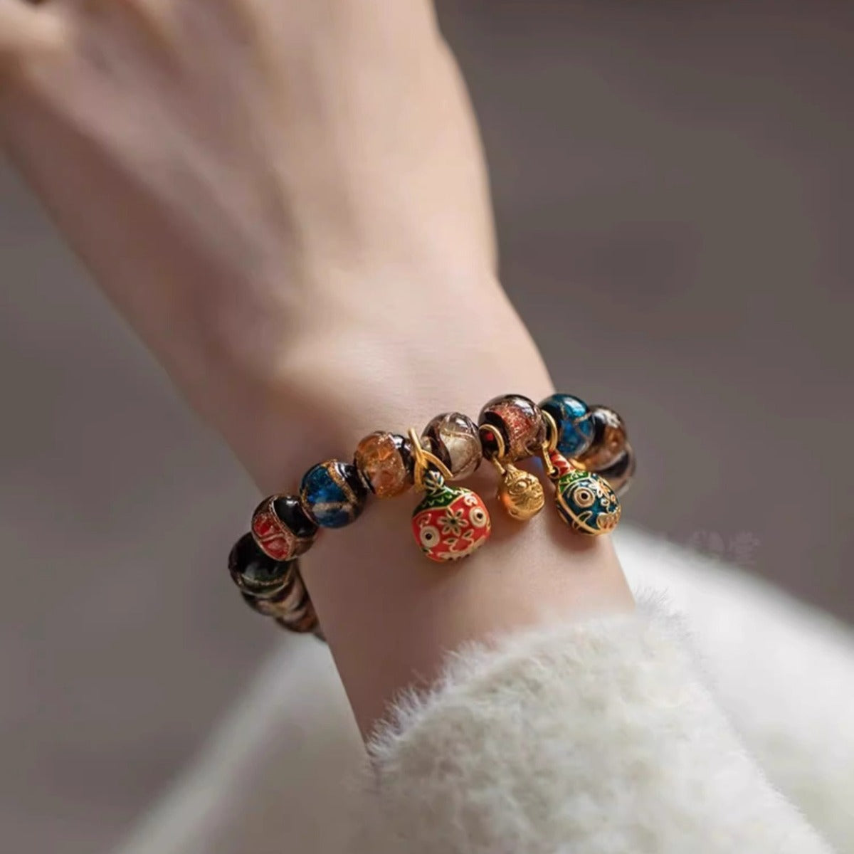 Bracelet: kiln-fired liuli glass beads in red, blue, green, white and brown, sixth view