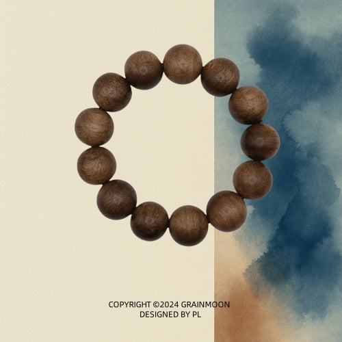 Bracelet: large dark brown agarwood beads with visible grain