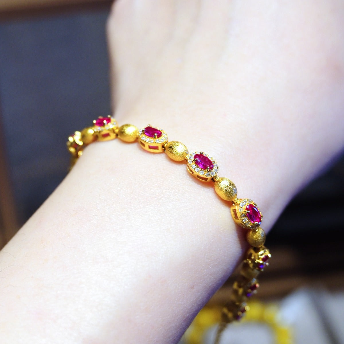 Bracelet: 18K gold plated oval beads with lab-created ruby stones in halos, second view