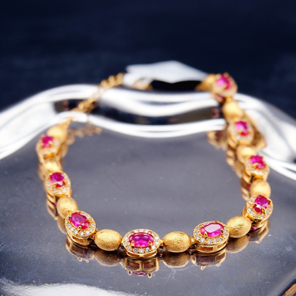 Bracelet: 18K gold plated oval beads with lab-created ruby stones in halos, fourth view