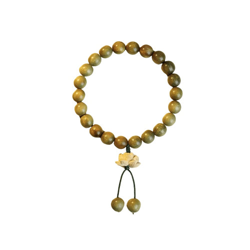 Bracelet: olive-brown green sandalwood beads with a carved boxwood lotus charm, second view