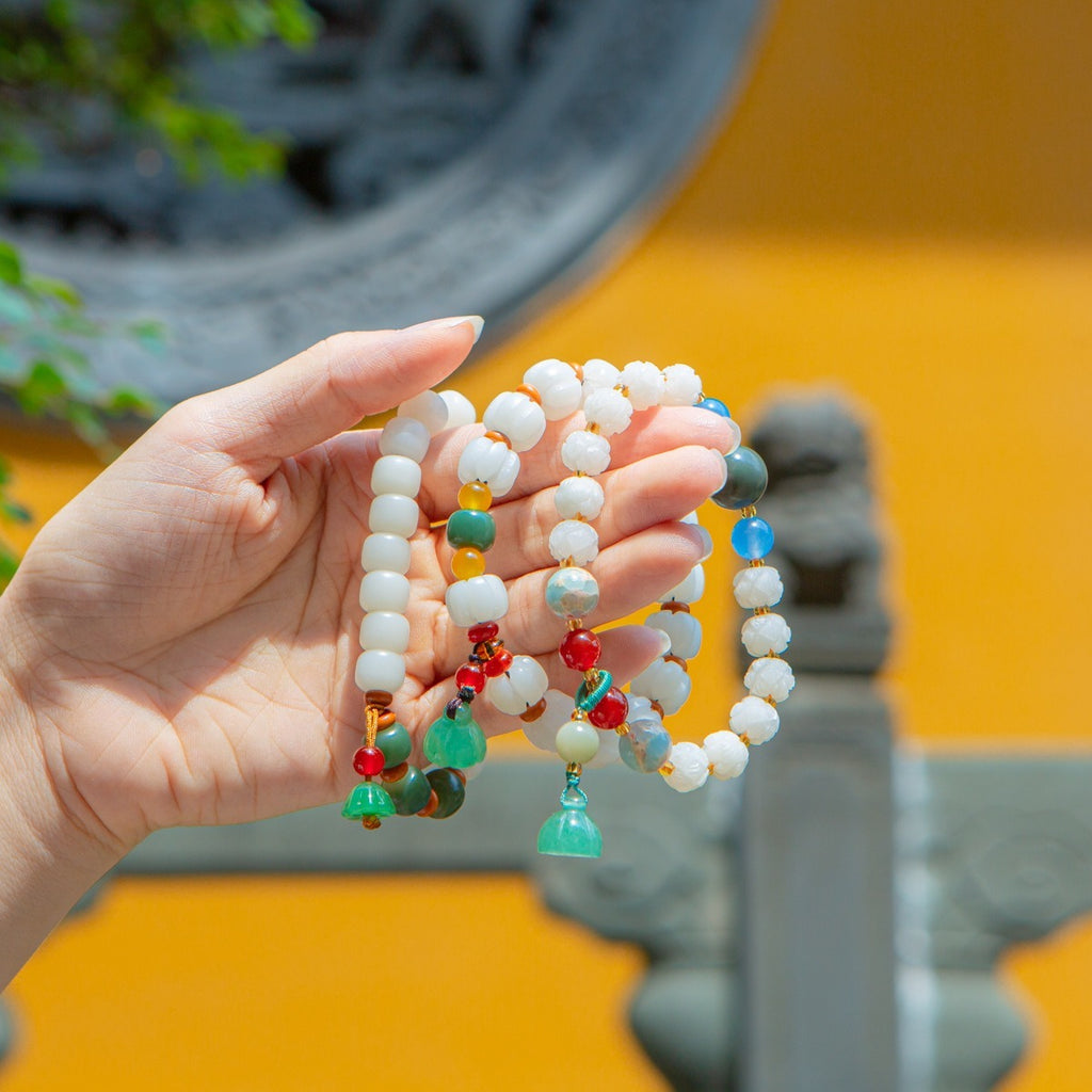 Bracelet: white lotus-petal bodhi root beads with blue, green and red accents, third view