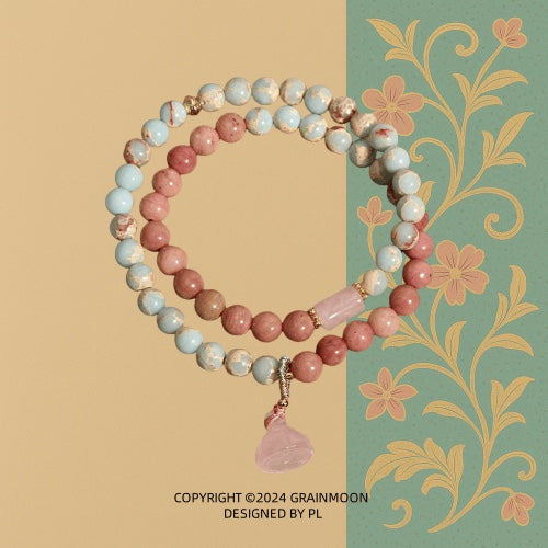 Bracelet: two strands of pink rhodonite and pale blue-cream stone beads with a pink carved lotus pod pendant