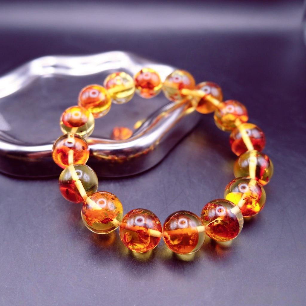 Bracelet: transparent golden flower amber beads, 12mm, second view