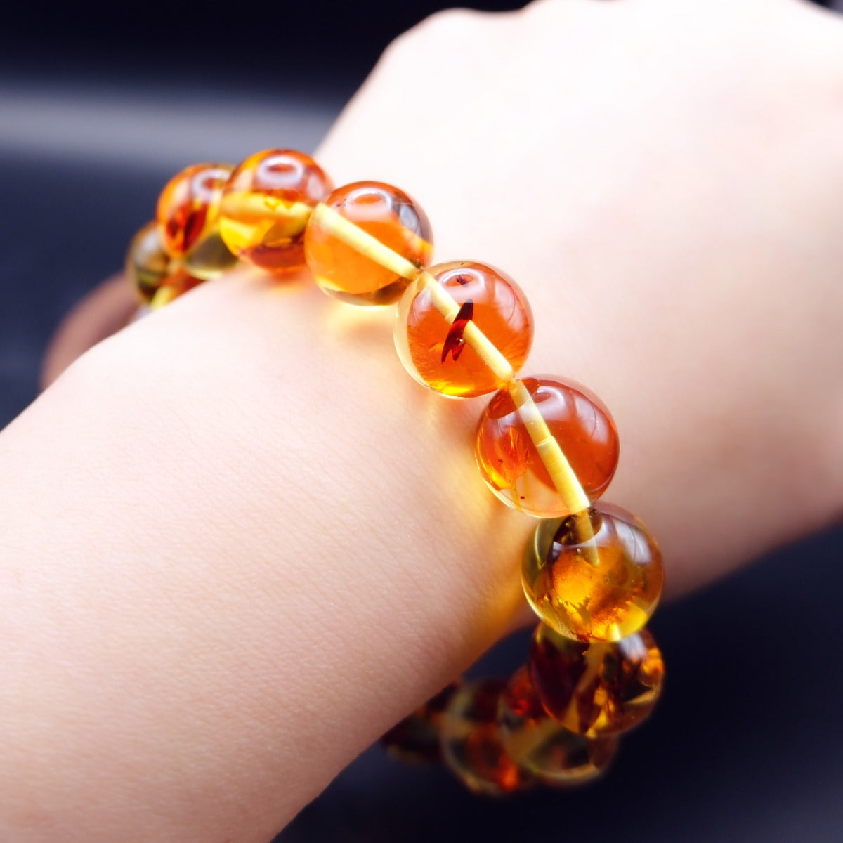 Bracelet: transparent golden flower amber beads, 12mm, third view