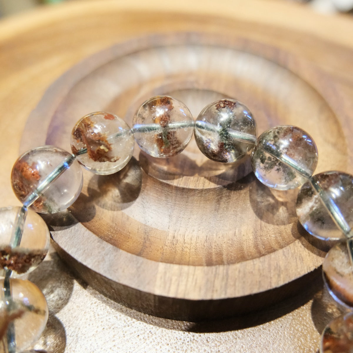 Bracelet: clear red phantom quartz beads, 13mm, with red-brown inclusions, second view