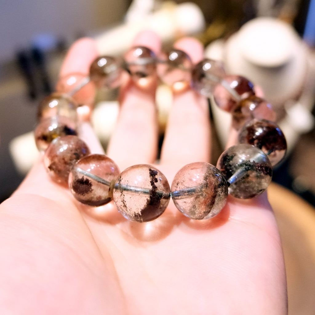 Bracelet: clear red phantom quartz beads, 13mm, with red-brown inclusions, third view