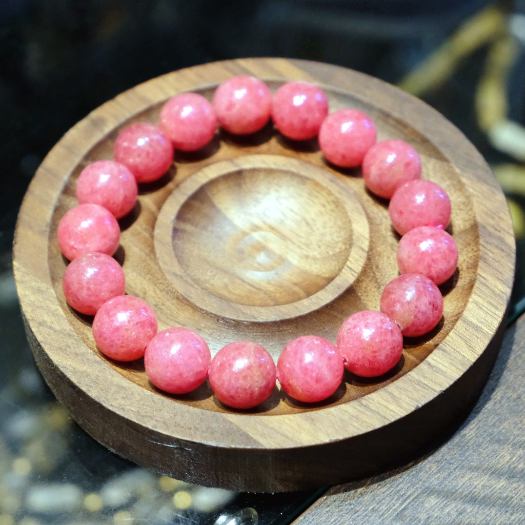 Bracelet: round pink rhodonite beads, 10mm, with black veining, third view