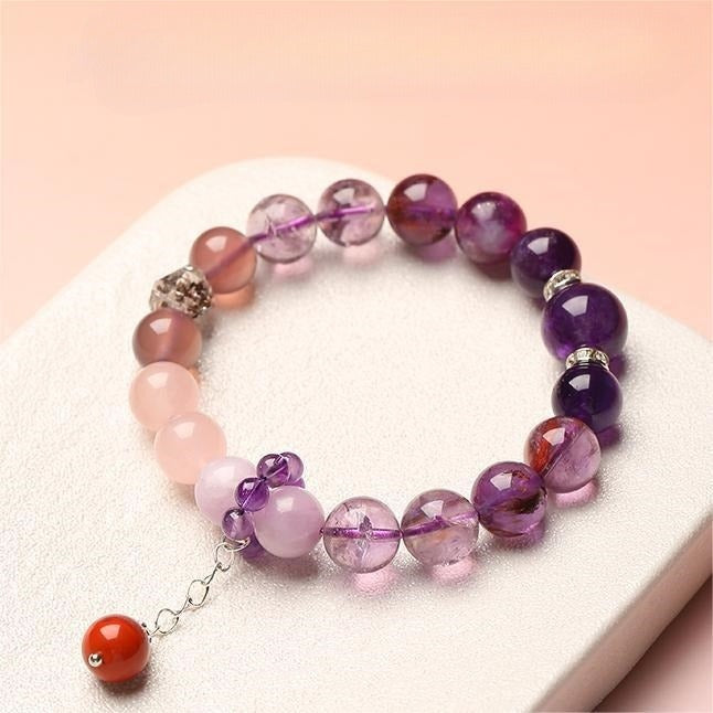 Bracelet: violet amethyst beads with pink rose quartz beads and a red agate bead on a short chain