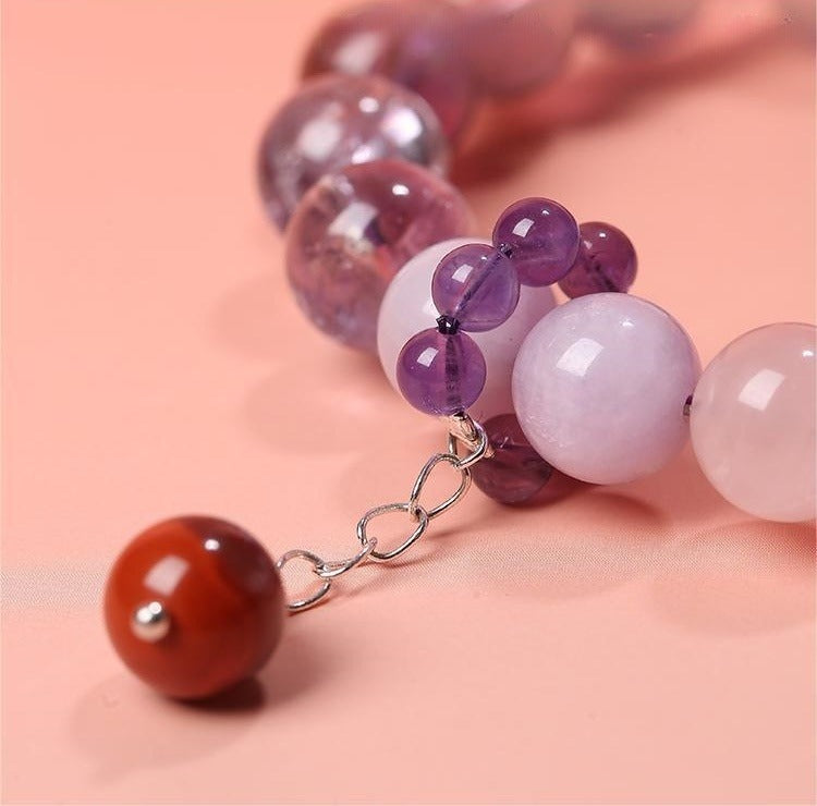 Bracelet: violet amethyst beads, 10mm, with rose quartz and a red agate bead, second view