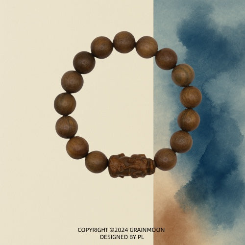Bracelet: brown green sandalwood beads with one bead carved as a Pixiu