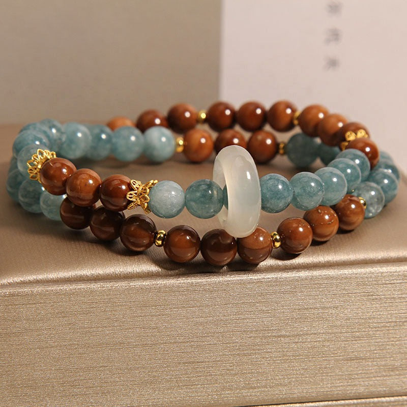 Bracelet: blue-green amazonite beads and brown wood beads with a chalcedony ring, second view