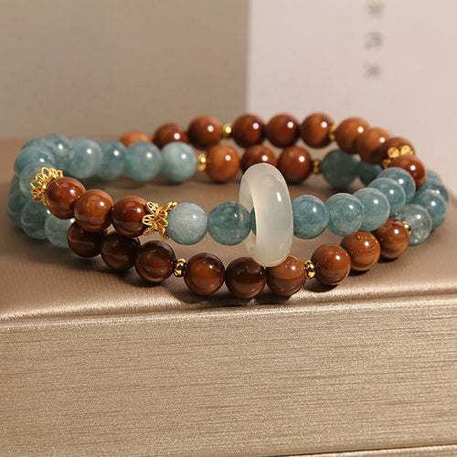 Bracelet: blue-green amazonite beads and brown wood beads with a chalcedony ring, second view