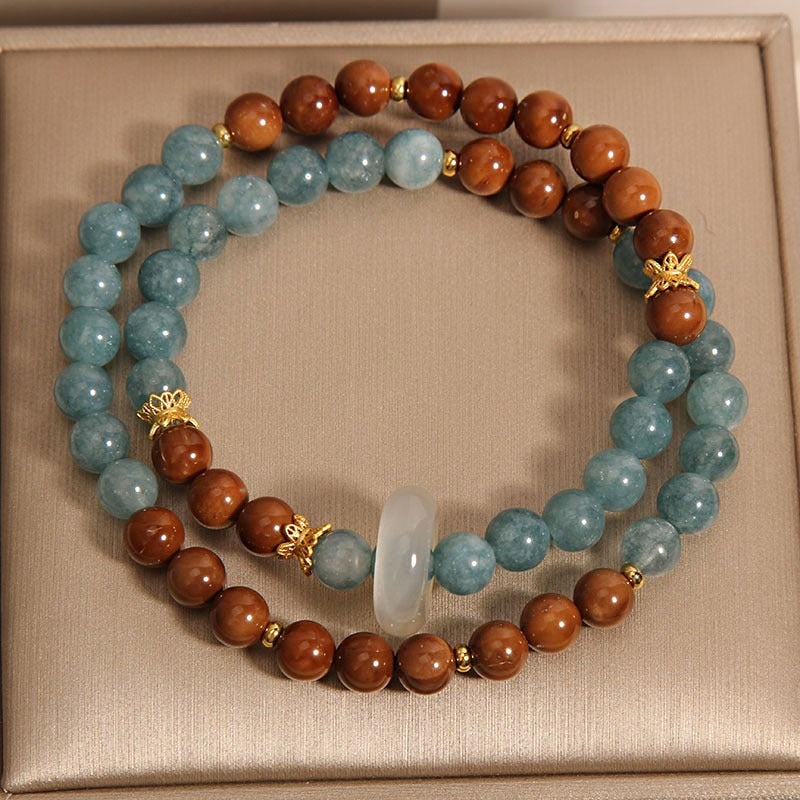 Bracelet: blue-green amazonite beads and brown wood beads with a chalcedony ring, third view