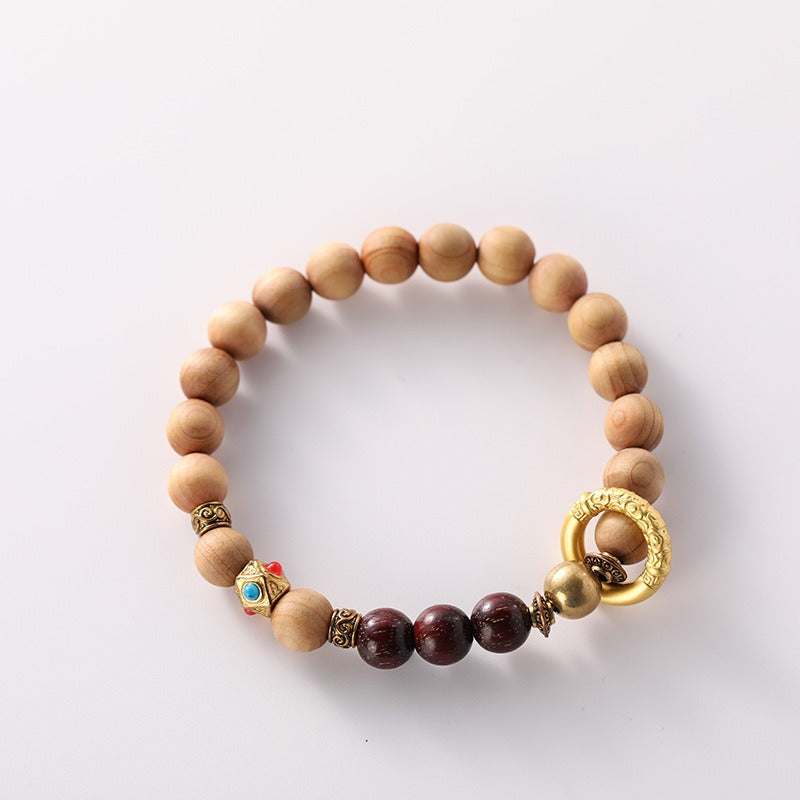 Bracelet: light brown Ya Bai cypress beads with dark red-brown accent beads, second view