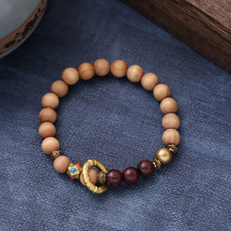 Bracelet: light brown Ya Bai cypress beads with dark red-brown accent beads, fourth view