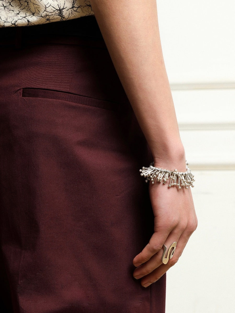 Bracelet: sculptural polished design of radiating tubes with ball ends, third view