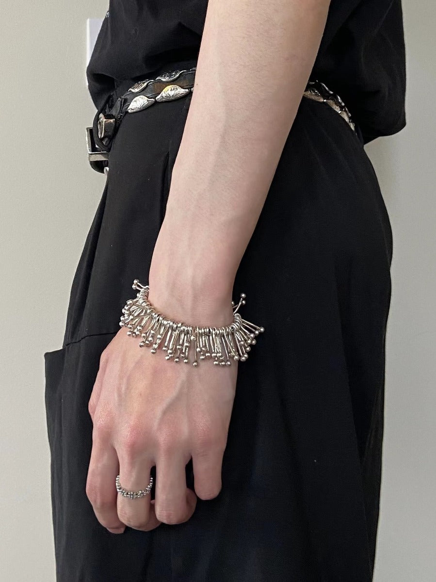 Bracelet: sculptural polished design of radiating tubes with ball ends, sixth view