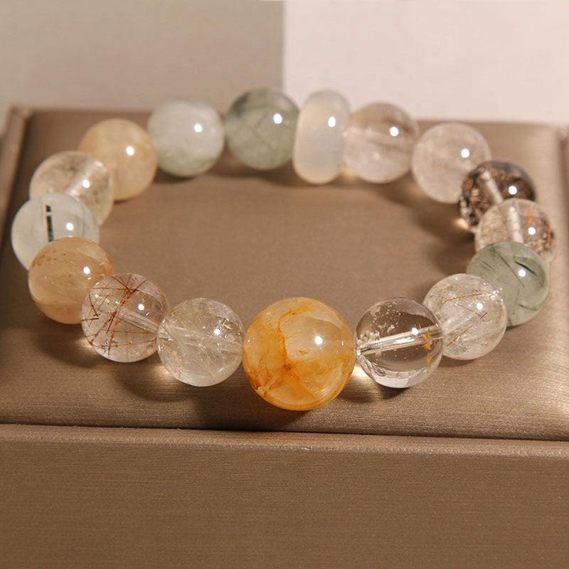 Bracelet: rutilated quartz beads with golden, red, green and black inclusions, second view