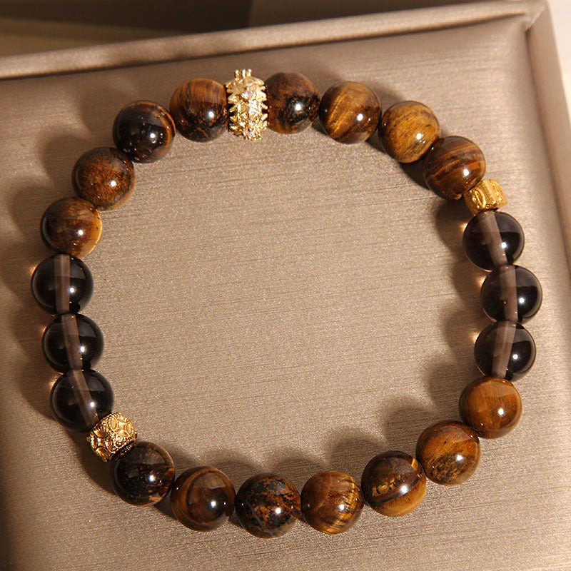 Bracelet: brown tiger's eye beads and smoky crystal beads with a carved accent, second view