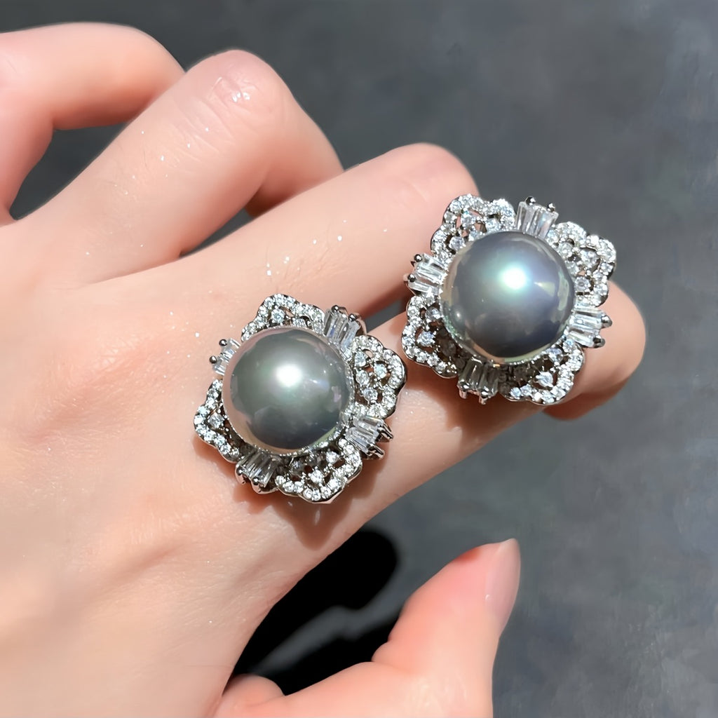 Earrings: two grey cultured Tahitian pearls in flower-shaped halos, fourth view