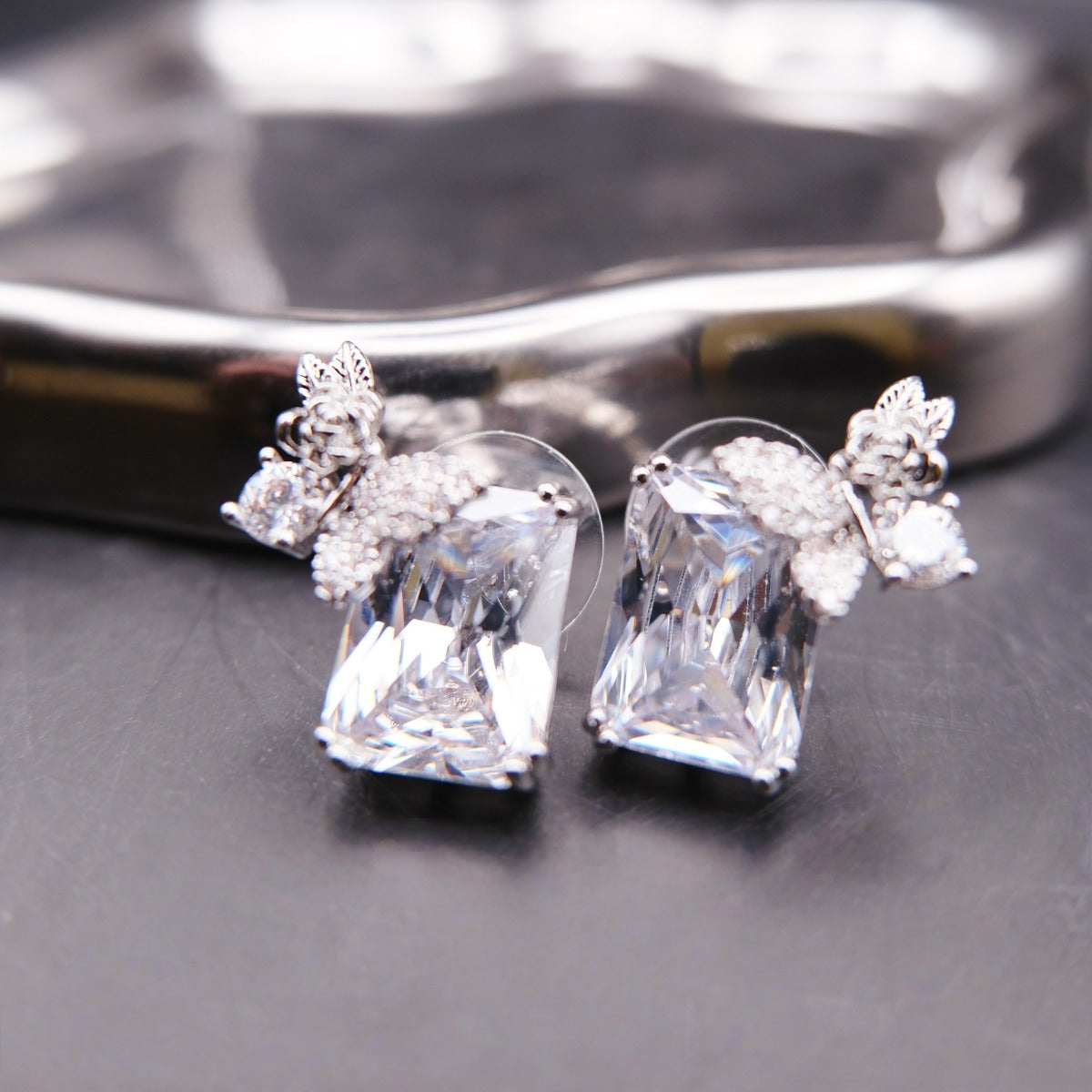 Earrings: clear emerald-cut cubic zirconia with butterfly and flower motifs, fifth view