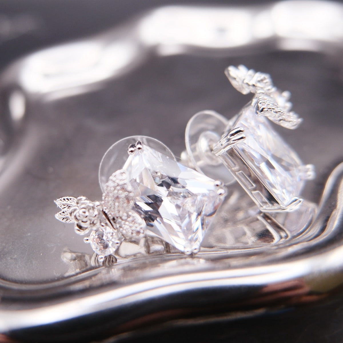Earrings: clear emerald-cut cubic zirconia with butterfly and flower motifs, sixth view