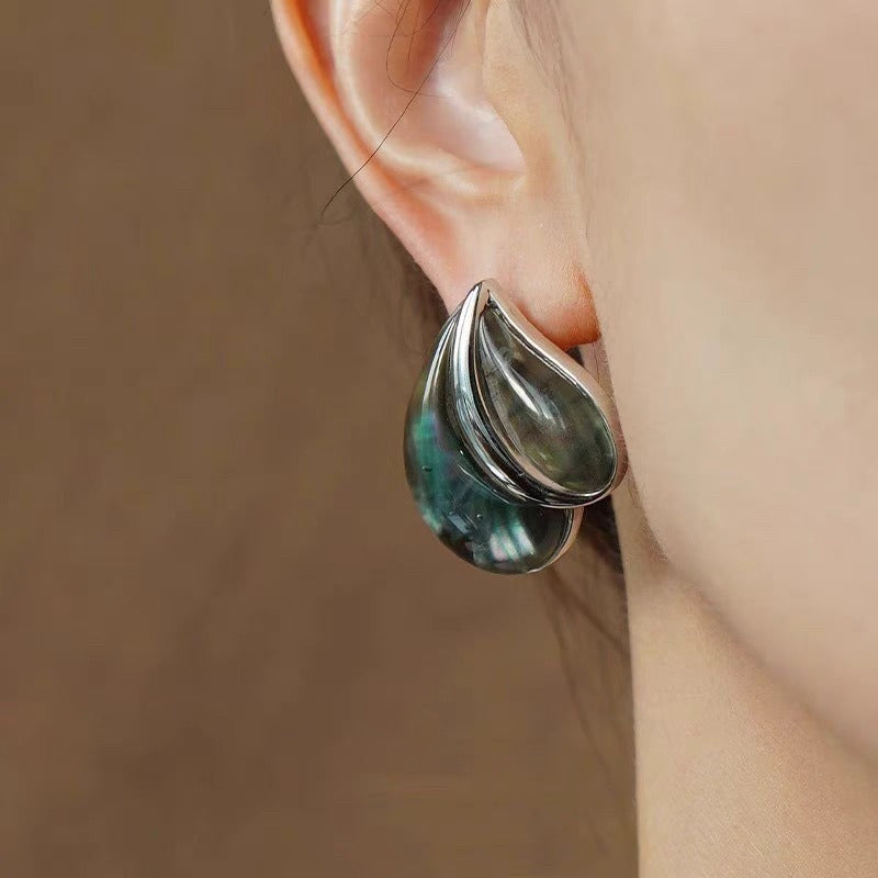 Earrings: iridescent black mother-of-pearl teardrops in a heart shape, second view