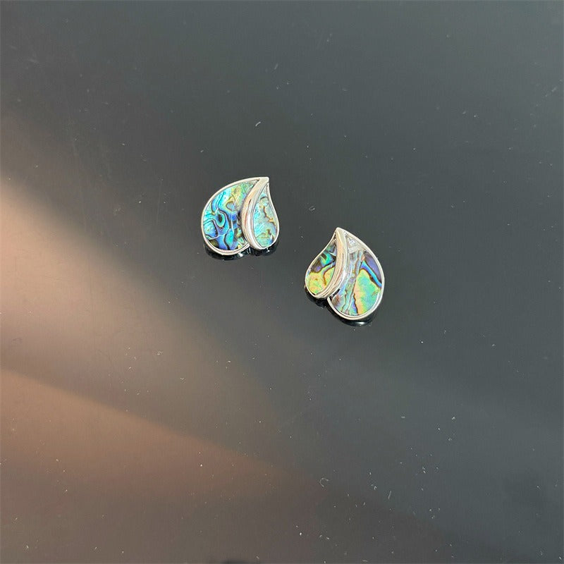 Earrings: iridescent black mother-of-pearl teardrops in a heart shape, fifth view