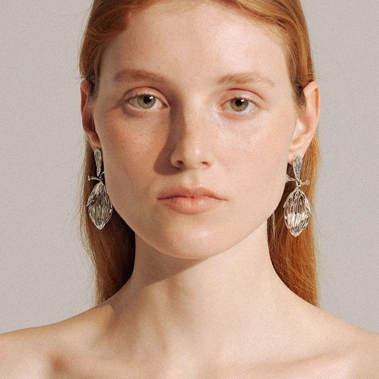 Earrings: textured 925 sterling silver stud with a ribbed leaf-shaped drop, third view