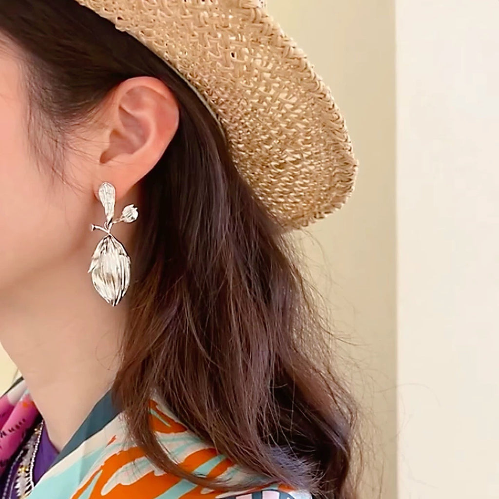 Earrings: textured 925 sterling silver stud with a ribbed leaf-shaped drop, fifth view
