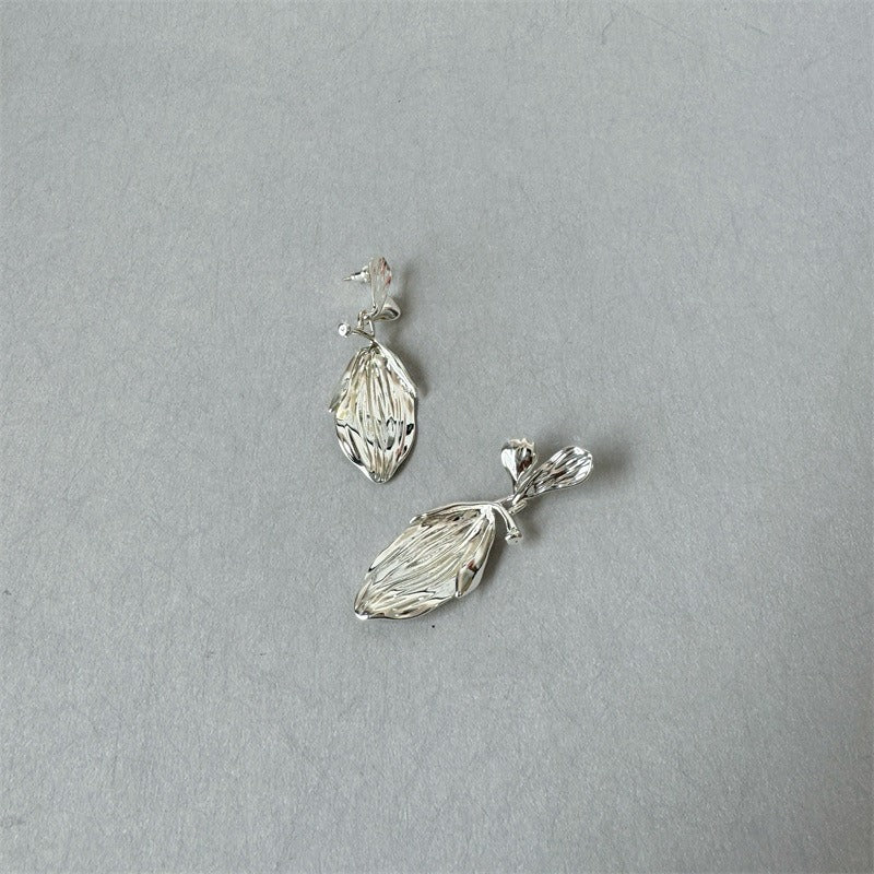 Earrings: textured 925 sterling silver stud with a ribbed leaf-shaped drop, seventh view