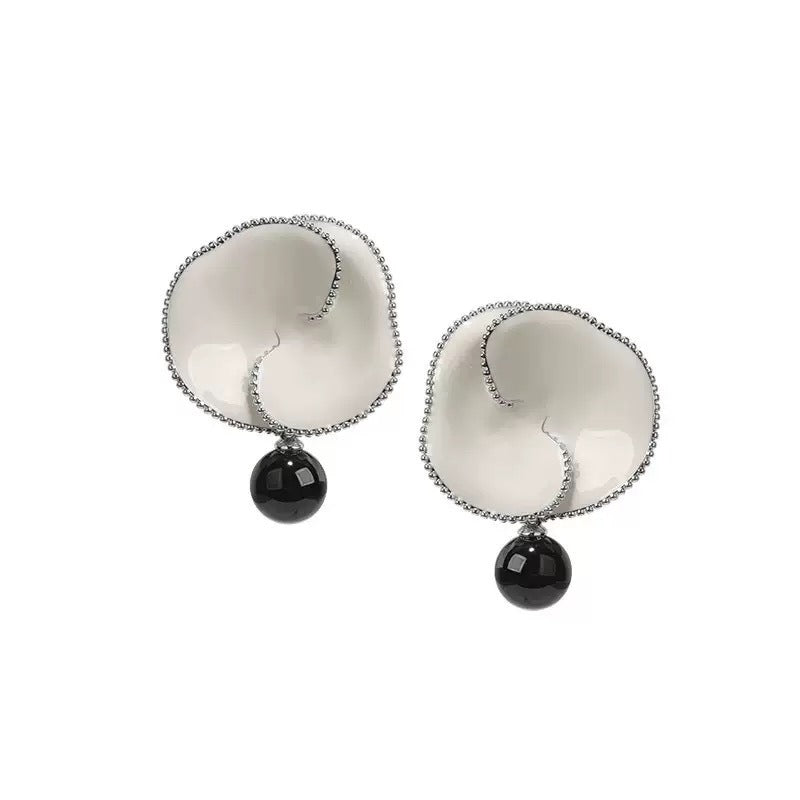 Earrings: white enamel crown of thorns flowers with a black agate bead drop, second view
