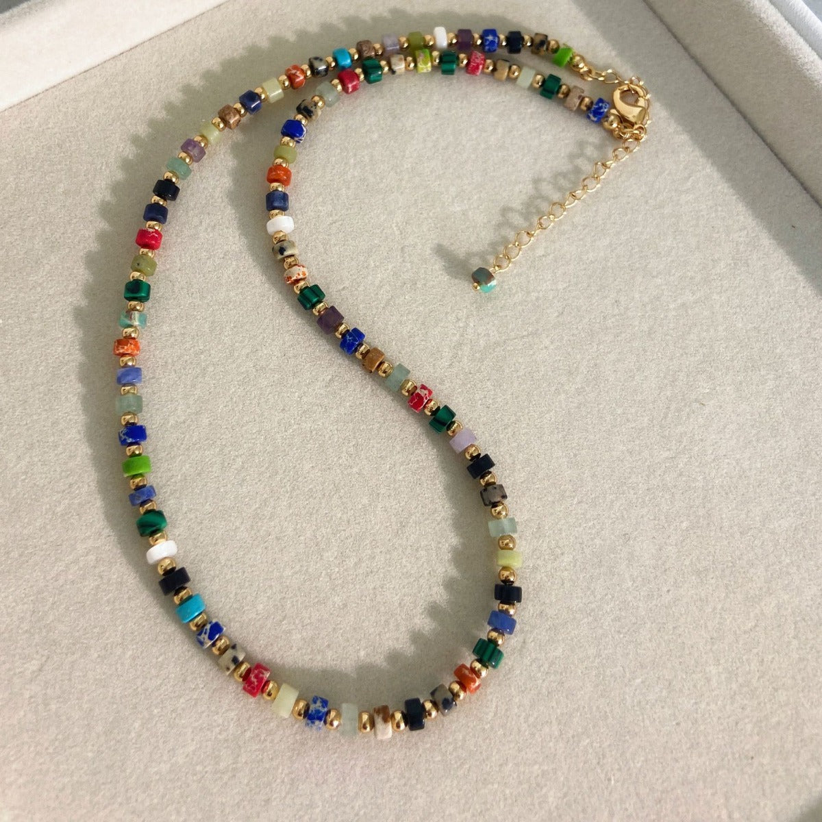 Necklace: strand of small multi-coloured mixed gemstone beads, third view