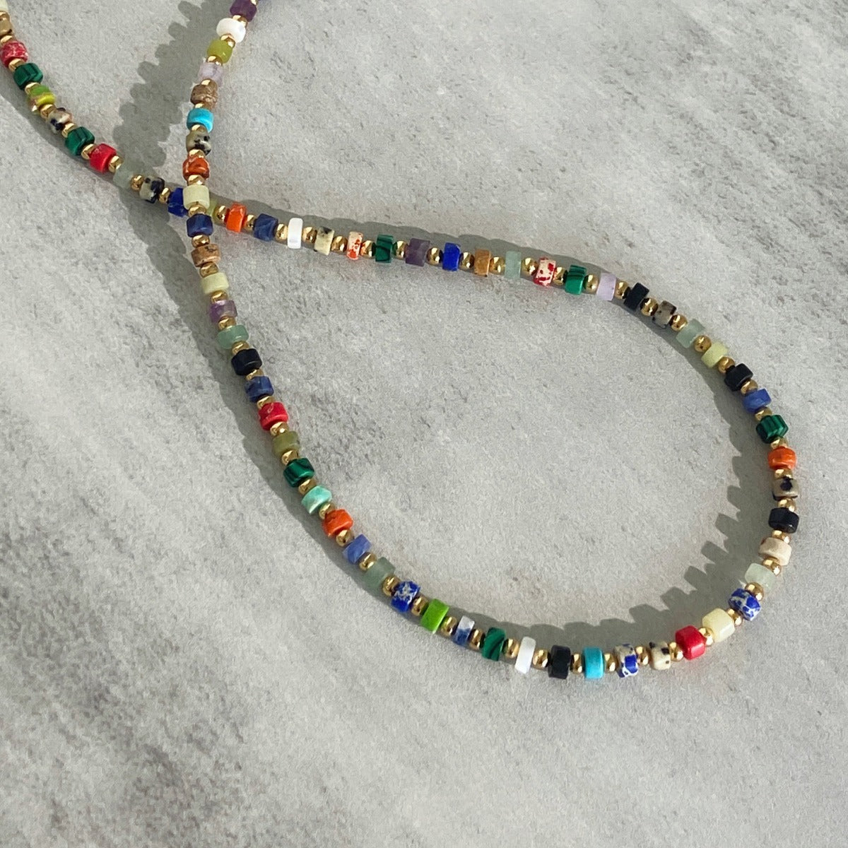 Necklace: strand of small multi-coloured mixed gemstone beads, fourth view