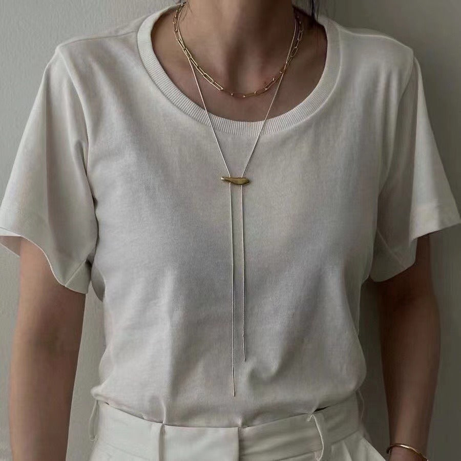 Necklace: silver-coloured snake chain with a gold-coloured slider bar, fourth view