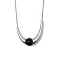 Necklace: round black agate bead held in a polished curved 925 sterling silver arc on a chain