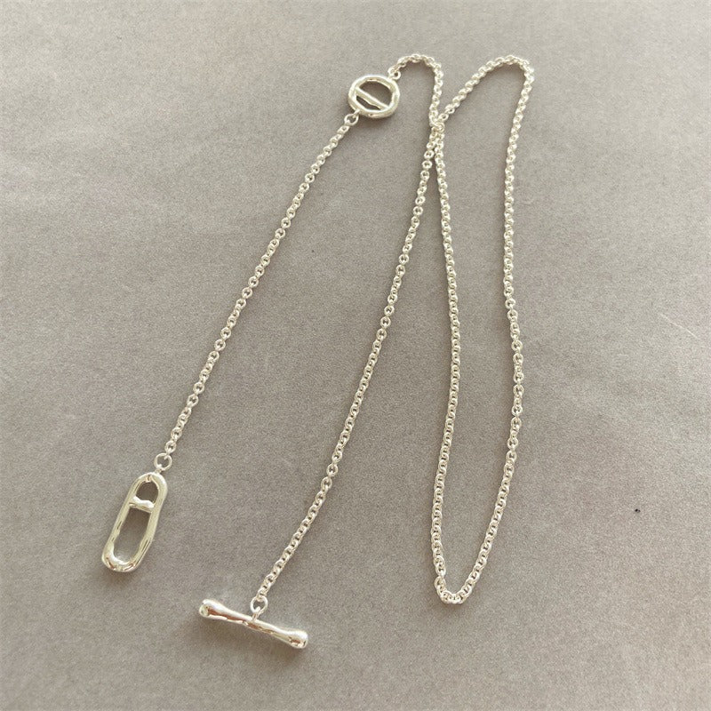 Necklace: long polished chain with two oval links and a T-bar toggle, fourth view